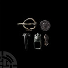 Roman and Medieval Artefact Group. c.1st-15th century A.D. A mixed group of five artefacts comprising: an Iron Age-Celtic brooch; Roman dolphin brooch...