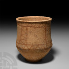 Amlash Painted Storage Vessel. 13th-12th century B.C. A ceramic carinated vessel with everted rim and shallow foot, ochre-coloured painted geometric m...