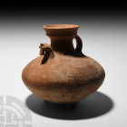 Amlash Vessel with Horse. 13th-12th century B.C. A vessel with squat carinated vessel with two stubby conical legs pierced through to the body, funicu...