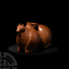 Central Asian Rhyton in the Shape of a Ram. 1st millennium B.C. A ceramic rhyton formed as a stylised kneeling ram with figure of eight-shaped body, i...
