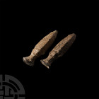 Bactrian Fish Amulet Pair. 3rd-2nd millennium B.C. A pair of amuletic lead vessels formed as stylised fish with detailing to scales and heads, exagger...