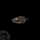 Roman Phallic Seal Box Lid. 2nd-3rd century A.D. A seal box lid with hinge lug to broad edge, stylised phallus to upper face in raised relief with ena...