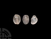 Roman Rock Crystal Bead Collection. 1st-3rd century A.D. A group of three rock crystal beads comprising one melon bead and two amorphous beads; each p...