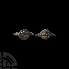Roman Seal Ring Pair. 1st century B.C.-3rd century A.D. A group of two seal rings with D-section hoops and discoid bezels, each with a stylised animal...