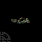 Roman Phallic Pendant. 2nd-3rd century A.D. A bronze amuletic pendant formed as a phallus with transverse bar to the base, integral loop above. Cf. Be...