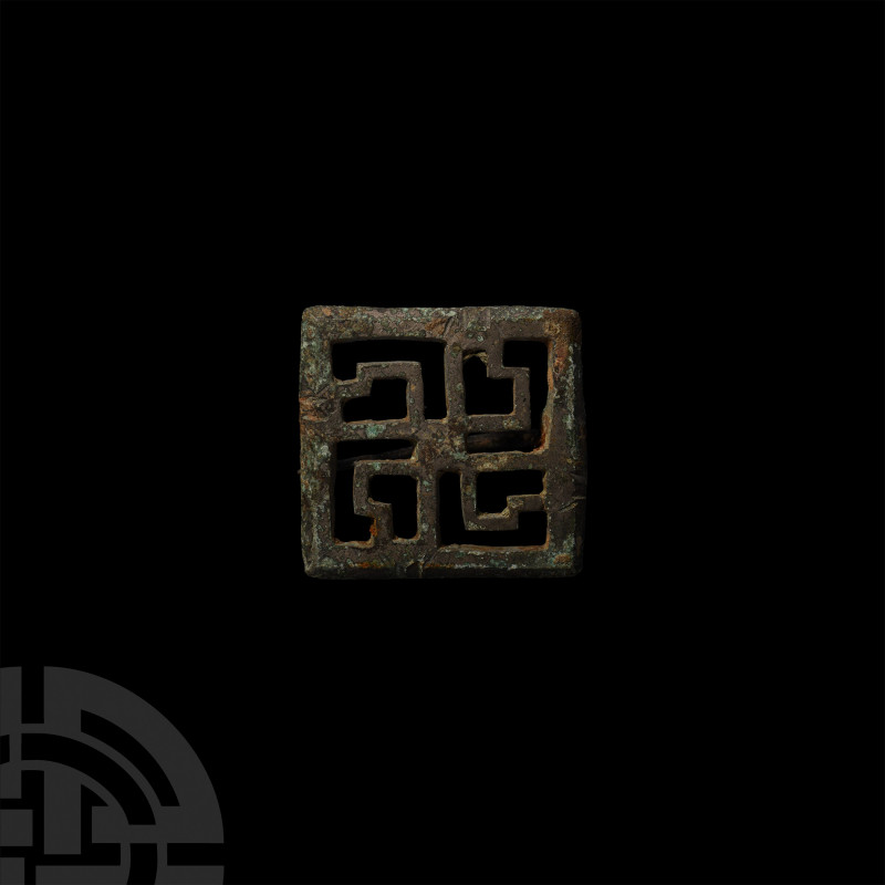 Roman Swastika Plate Brooch. 2nd-3rd century A.D. A plate brooch composed of a s...