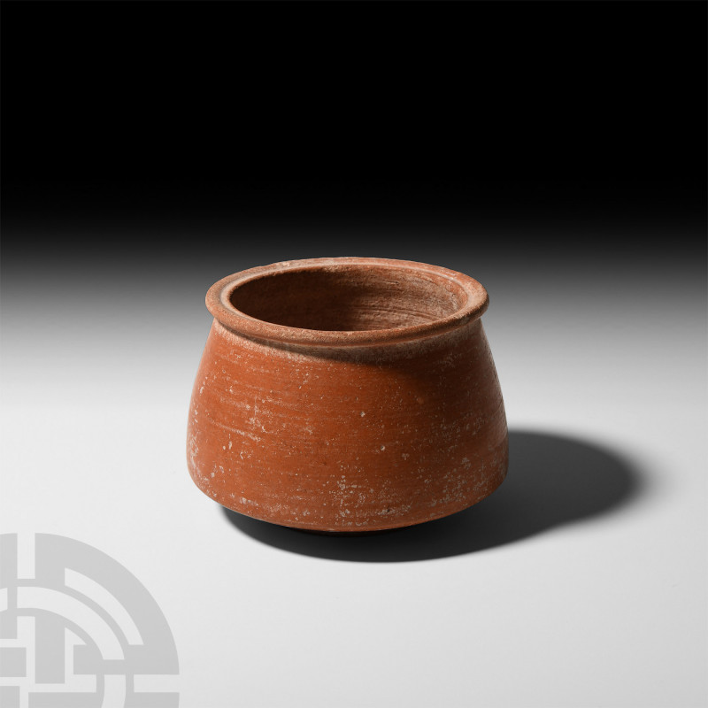 Roman Red Ware Bowl. 2nd-4th century A.D. A redware bowl with carinated body, ev...