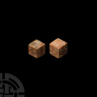 Roman Bone Dice Pair. 1st-4th century A.D. A pair of bone dice composed 1:6; 2:5; 3:4 and 1:6; 2:3; 4:5. 4.32 grams total, 10-11 mm (1/4 in.) Acquired...