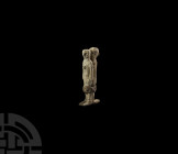 Roman Handle with Captives. 1st-3rd century A.D. A heavy lead handle or mount formed as two captives, bound together with an iron ferrule around the f...