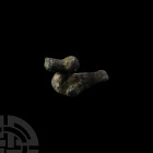 Romano-Celtic Bird Figurine. 1st century B.C.-2nd century A.D. A bronze figurine modelled in the round as a stylised sitting bird or duck with exagger...