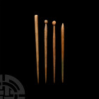 Roman Bone Hair Pin Collection. 1st-3rd century A.D. A mixed group of four bone hair pins with round-section stems, comprising two with globular finia...