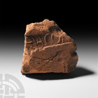 Roman Military Stamped Tegula Fragment from Caerleon. 1st-3rd century A.D. A ceramic tile fragment (tegula) with remains of stamped text '..A.CUN..'; ...