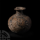 Chandraketugarh Globular Vase with Flying Goddesses. 2nd-1st century B.C. A globular vase with broad everted rim decorated with petals, an elaborate d...