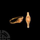 Roman Altar Gemstone in Gold Ring. 1st century A.D. A carnelian intaglio gemstone with image of a fire altar, granules to either side; set into a late...
