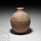 Roman Terracotta Ribbed Jar. 1st-3rd century A.D. A terracotta jar with cylindrical neck, three rows of raised ribs around the body. 1.6 kg, 24.5 cm h...