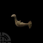 Roman Sea Creature Pendant. 1st-3rd century A.D. A stylised sea creature with the body of a bird and tail of a fish; remains of suspension loop. 10.4 ...