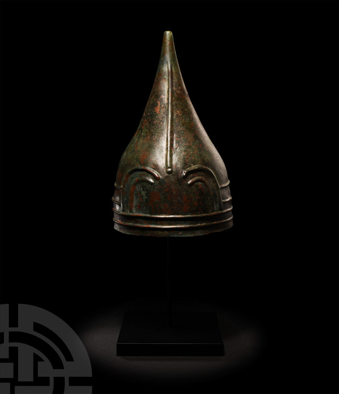 Urartian Helmet with Snakes. 8th-7th century B.C. A broad conical bronze helmet,...