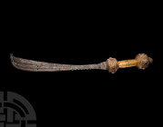 Ashanti Ceremonial Sword. 19th century A.D. An akrafena ceremonial sword comprising: a wooden hilt with sheet-gold surface, two drum-shaped lobes with...