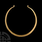Celto-Iberian Gold Neck Torc. 4th-2nd century B.C. A heavy penannular gold neck torc with carinated body and tapering coiled terminals. 165 grams, 14....
