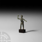 Iron Age Celtic Statuette. 2nd century B.C.-2nd century A.D. A bronze statuette modelled as a stylised naked male figure, standing with one arm outstr...