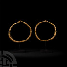 Viking Age Child's Gold Twisted Bracelet Pair. 9th-11th century A.D. A pair of small gold bracelets composed of twisted round-section hoops, tapering ...