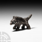 Viking Silver 'Great Beast' Figure. c.11th century A.D. A silver zoomorphic statuette of a 'Great Beast' modelled in the round, standing with a beak-l...