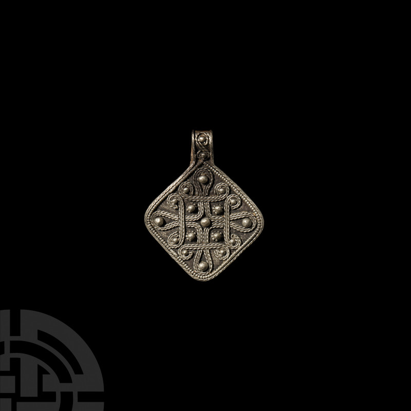 Viking Age Silver Filigree Pendant. 9th-11th century A.D. A silver lozengiform p...