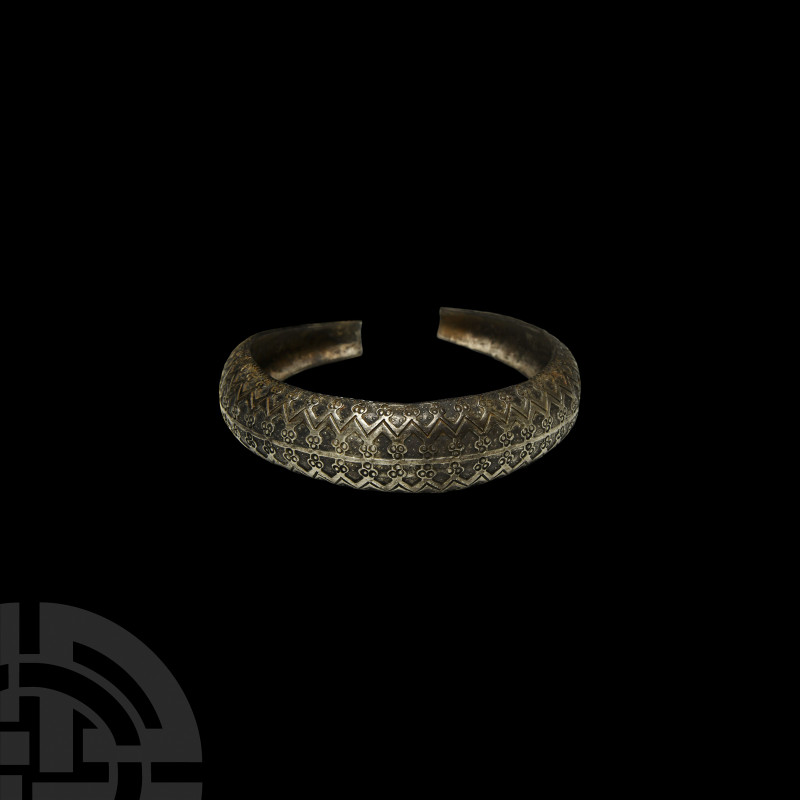 Viking Age Silver Bracelet with Ornate Design. 9th-10th century A.D. A silver pe...
