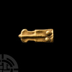 Medieval Gold Strap End. 15th century A.D. A gold strap end with rectangular-section hollow-form body and two rivets to one edge. 2.49 grams, 22 mm (7...