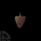 Medieval 'Tiptoft Family' Heraldic Horse Harness Pendant. 13th-14th century A.D. A heater-shaped horse harness pendant with red enamelled saltire engr...