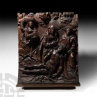 1460-1531 A.D. A substantial carved wooden panel with figures in high-relief against a field of vegetation; recumbent Christ with his head supported i...