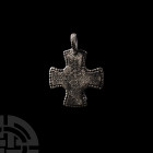 Byzantine Silver Cross Pendant. 8th-10th century A.D. A silver pectoral cross with slightly flared arms, pelletted border to the obverse and punched d...