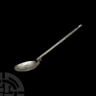 Byzantine Silver Spoon. 6th-9th century A.D. A silver spoon with facetted stem, shallow oval-shaped bowl and acorn-shaped finial. 42.6 grams, 18.2 cm ...
