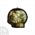 Medieval Stained Glass Head of a Bearded Man. c.1550 A.D. A stained glass panel in lead-alloy frame, painted image of an older man looking upwards wit...