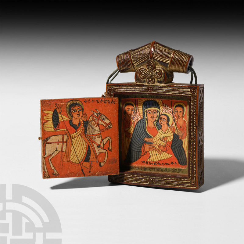 Ethiopian Pendant Diptych of the Virgin and Child. Late 17th century A.D. A wood...