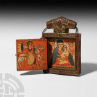 Ethiopian Pendant Diptych of the Virgin and Child. Late 17th century A.D. A wooden diptych with carved front and reverse faces, the hinged panel openi...