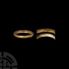 Gold 'Riches to Content' Posy Ring. 18th century A.D. A gold posy ring composed of a hollow D-section body, interior inscribed '[ ] riches to content'...