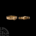 Gold 'Clasped Hands' Fede Ring with Flowers on Bezel. Later 16th-17th century A.D. A gold fede ring with D-section hoop, bezel formed as two clasped h...