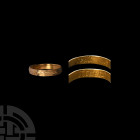 Gold 'Seale up Secretts' Posy Ring. 16th-17th century A.D. A gold posy ring with D-section hoop, the outer face decorated with dense horizontal dashes...