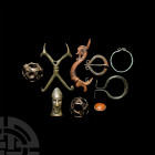 Artefact Group. Mainly 1st millennium B.C. A mixed group of artefacts comprising openwork spherical cages, likely pin heads; a penannular hoop with co...