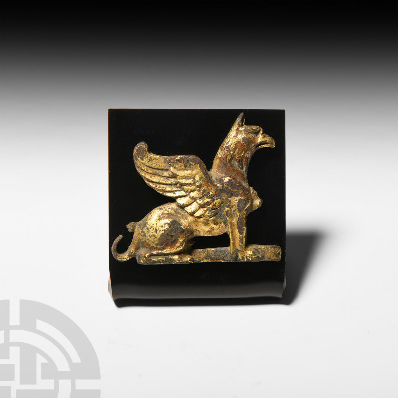 Tudor Age Gilt Griffin Mount. 16th-17th century A.D. A gilt griffin mount, the m...