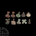 Central Asian Stamp Seal Group. Late 3rd-2nd millennium B.C. A mixed group of ten bronze seals of various shapes and designs, including seven accompan...