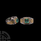 Silver Ring with Emerald and Diamonds. 20th century A.D. A silver ring stamped 925, the square bezel set with a central emerald, diamonds around. 13.1...