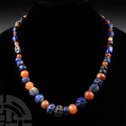 Mesopotamian Stone Bead Necklace. 2nd millennium B.C. and later. A restrung necklace composed of graduated red and blue lapis lazuli and agate beads o...