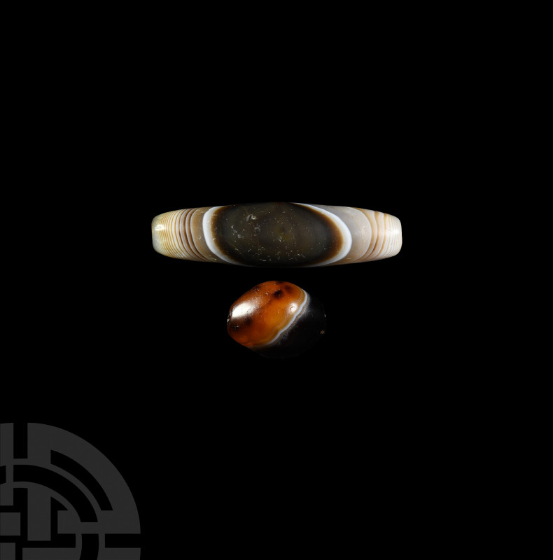Banded Agate Bead Group. 1st millennium B.C. and later. A pair of banded agate b...