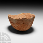 Chalcolithic Terracotta Bowl. 4th millennium B.C. A terracotta bowl with U-shaped profile, jagged lip and rounded base. 225 grams, 11.1 cm wide (4 3/8...