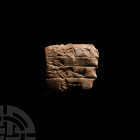 Late Uruk Proto-Cuneiform Tablet Section. c.3,500-3,100 B.C. A fragment of a proto-cuneiform tablet showing clear markings and symbols to one face. 4....