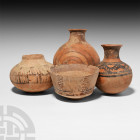 and Iron Age Vessel Group. 3rd millennium B.C. and later. A mixed group of four ceramic vessels, each painted with geometric motifs. 626 grams total, ...