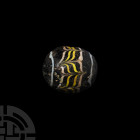 Glass Bead. 20th century A.D. A large polychrome barrel-shaped glass bead. 31 grams, 32 mm (1 1/4 in.) London collection since the 1980s. Property of ...