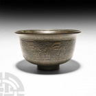 Bowl with Figures and Calligraphy. Late 19th century A.D. A carinated bronze bowl decorated with figures and panels of calligraphy between geometric b...